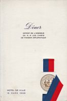 Dîner du 12 mars 1968<br />offert en l‘honneur<br />de M. M. les chefs<br />de Mission Diplomatique<br />Hôtel de ville de Paris<br /><br />Homard grillé Newburg<br />Selle d‘Agneau rôtie Châtelaine<br />Sauce Périgueux<br />Bouquetière de lègumes<br />Ballotine de Pintade en Volière<br />Pruneaux farçis Rossini<br />Laitue Mimosa<br />Fromages de France<br />Délices de Lutèce<br />Friandises<br /><br />Pouilly Fuissé Château de France 1966<br />Château Haut-Brion 1962<br />Corton Hospices de Beaune 1964<br />Champagne Pol Roger brut 1962 en magnum